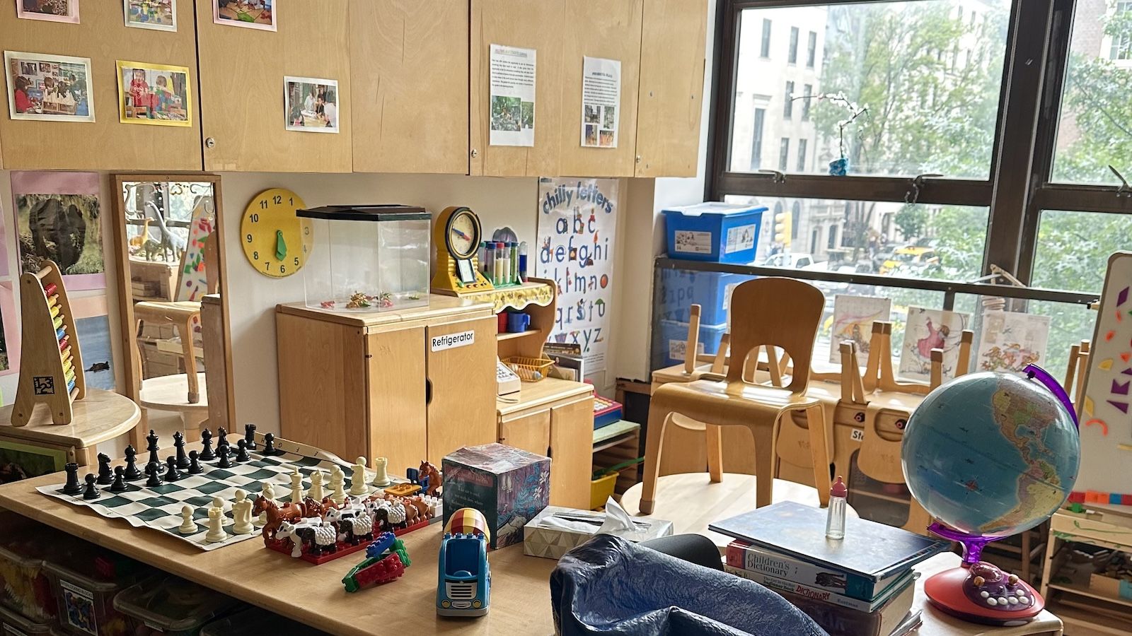 picture of the classroom with different activities such as checkers and globe