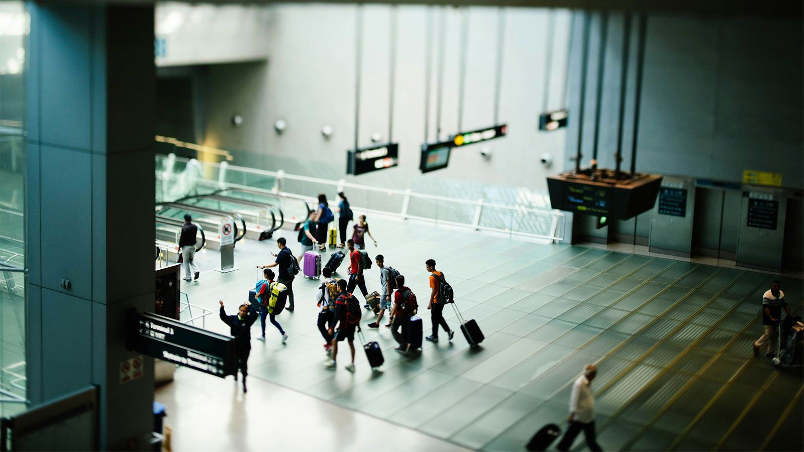 students in airport traveling