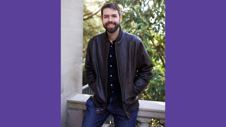 Headshot of Jason Lipshutz in a leather jacket surrounded by trees.
