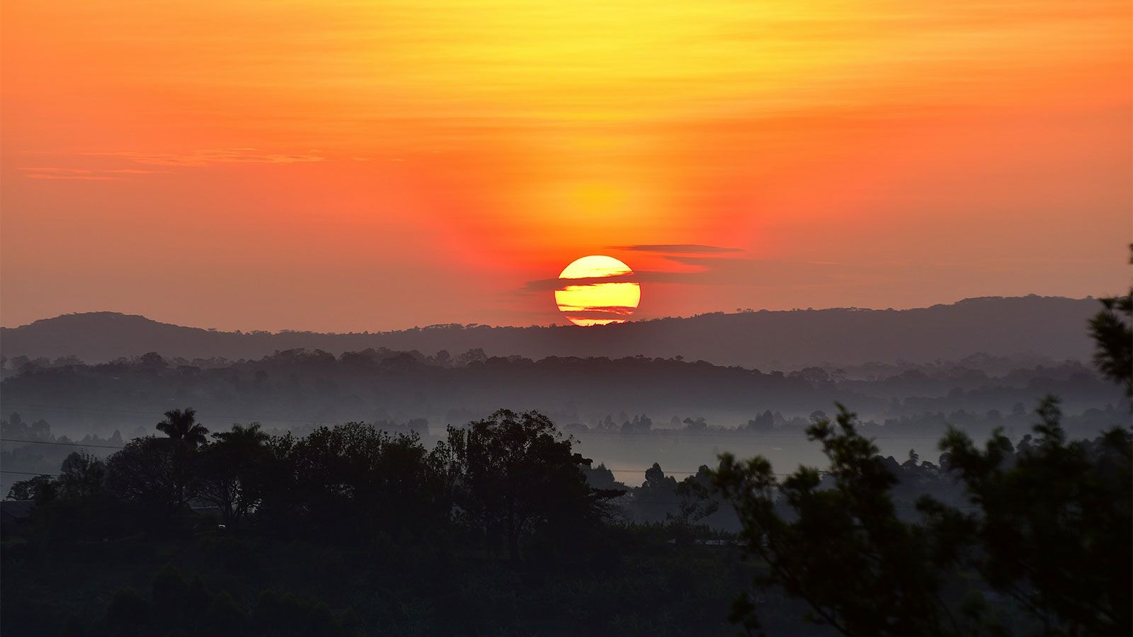 sunset over landscape of Uganda