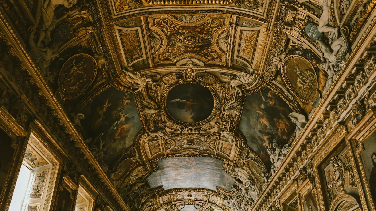 Ornately decorated ceiling at the Louvre Museum