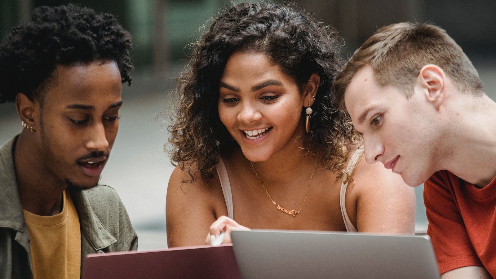 students looking at laptop