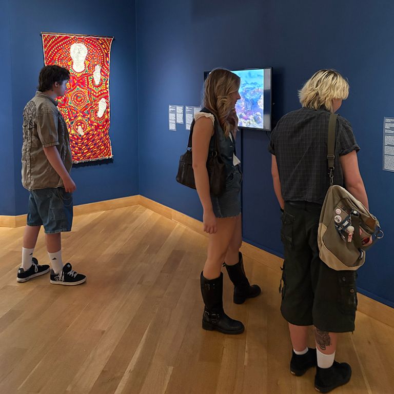 Students looking at art in the Leslie Lohman Museum