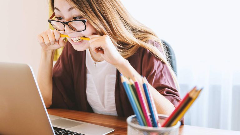happy student looking at screen