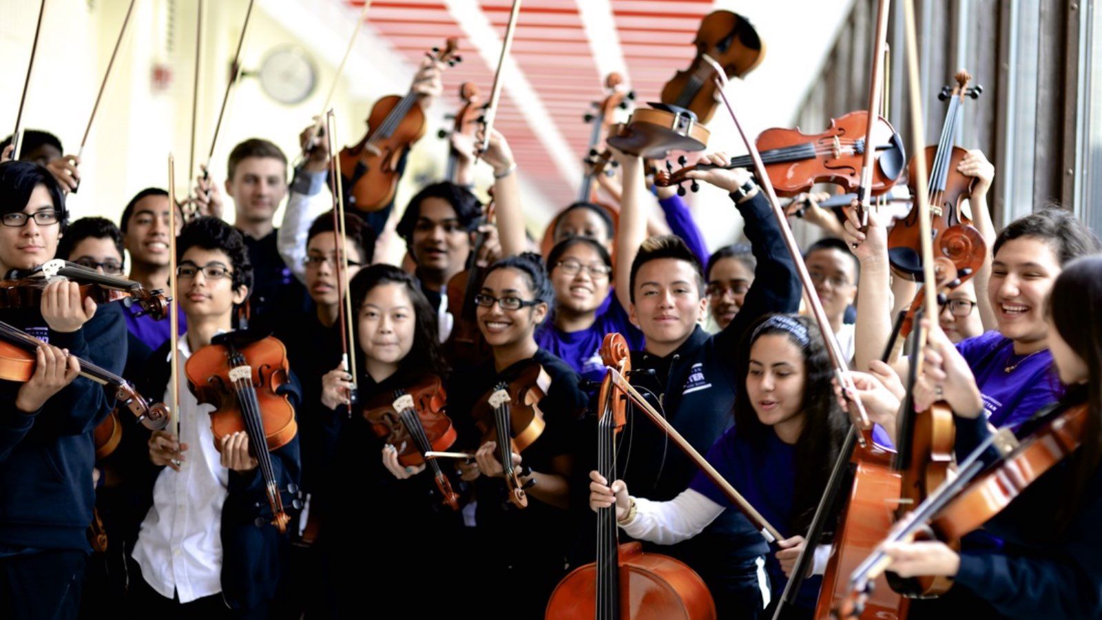 Group of students from Manhattan Hunter Science High School holding musical instruments.
