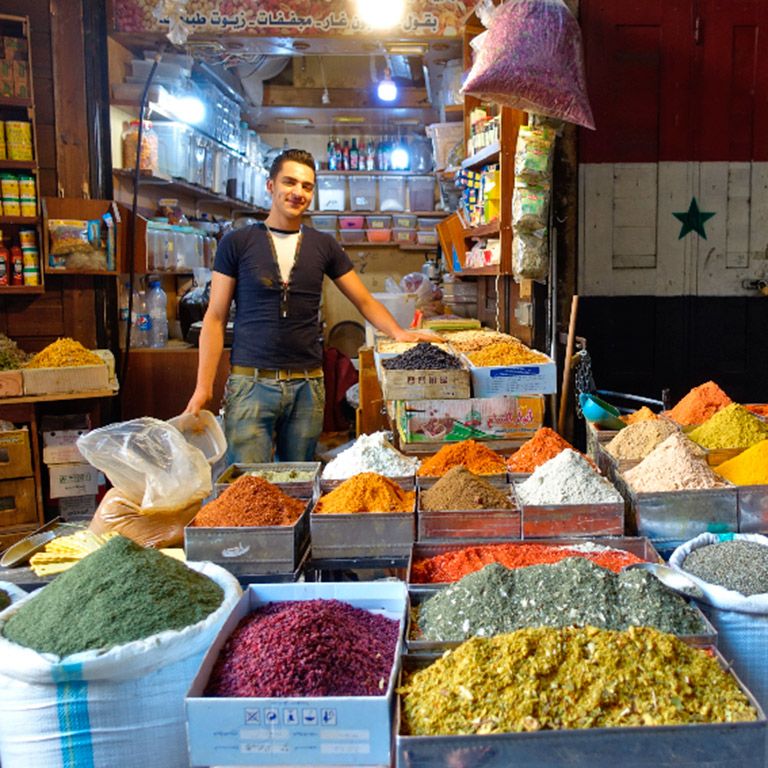 Marketseller in the spice souk in Damascus