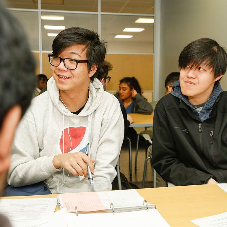 students sitting at table