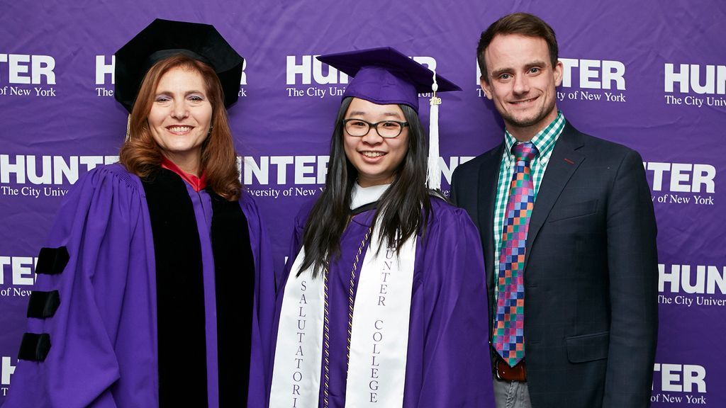 Raab and McNulty with graduate at commencemnt