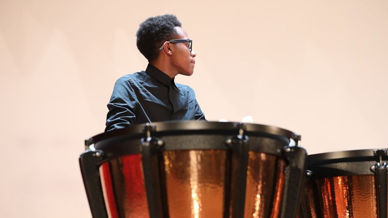 Student musician playing drums