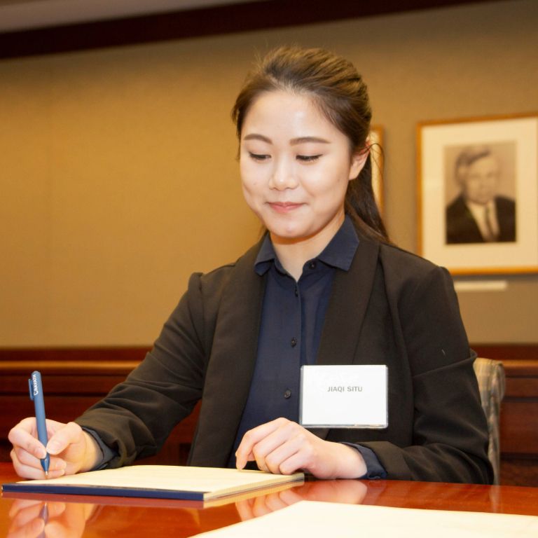 Student taking notes during Moot Court.