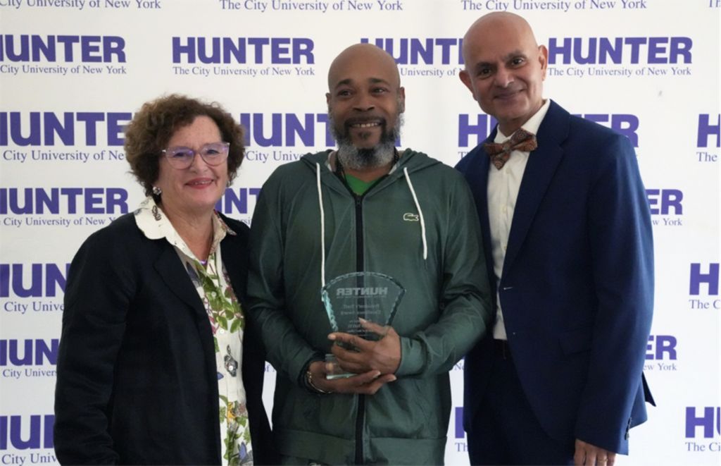 From left, President Nancy Cantor, Davis, and Provost Manoj Pardasani at the Presidential Staff Excellence Awards on September 16.