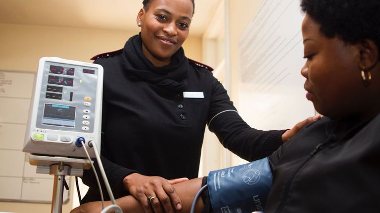 nurse taking blood pressure