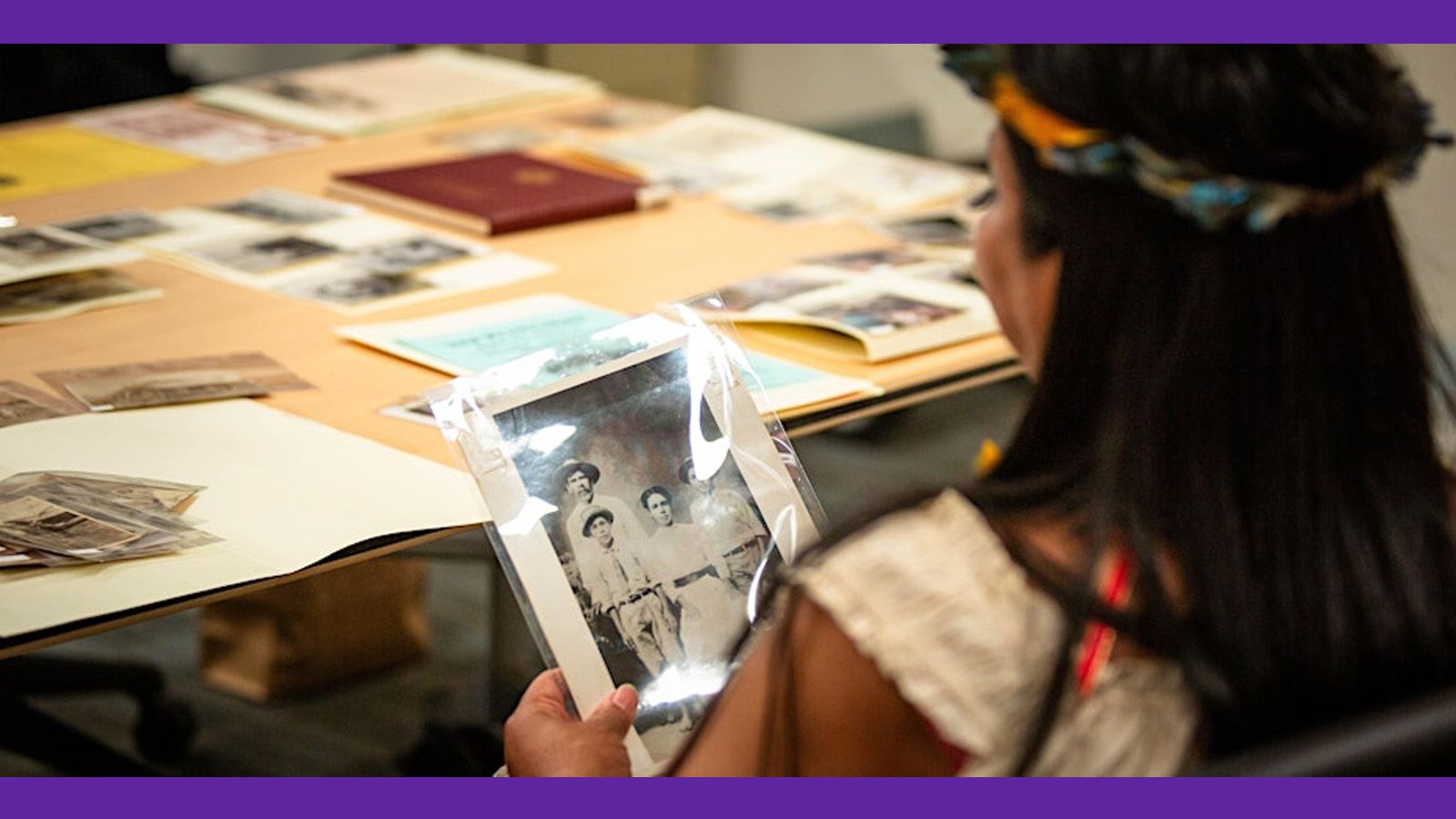 Image of a woman looking at old photos