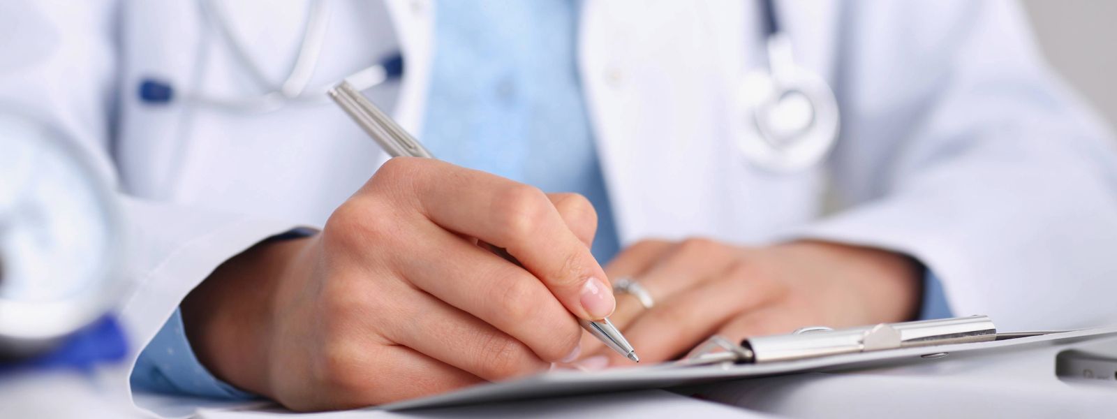 health professional writing note.
