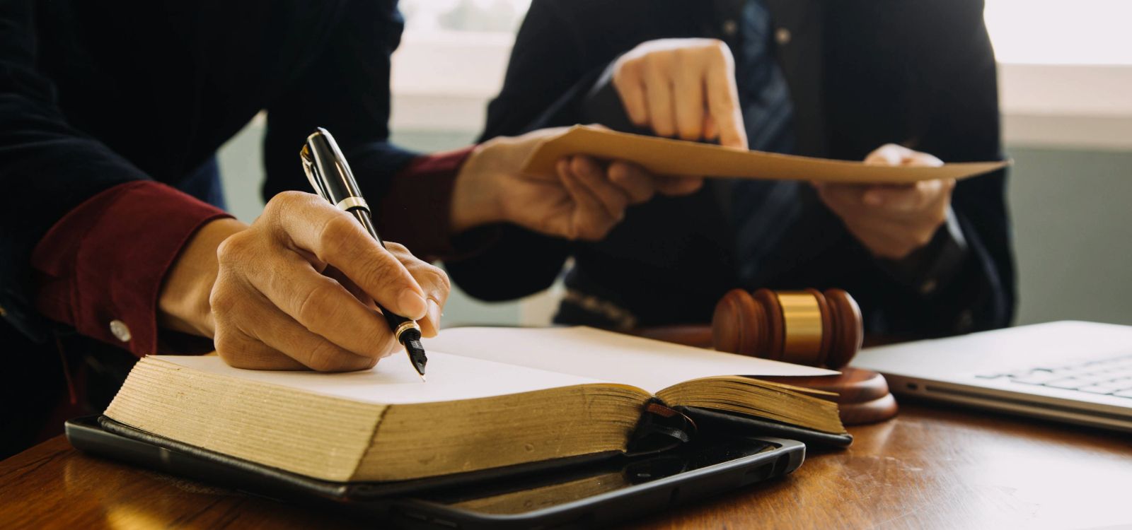 Person signing documents.