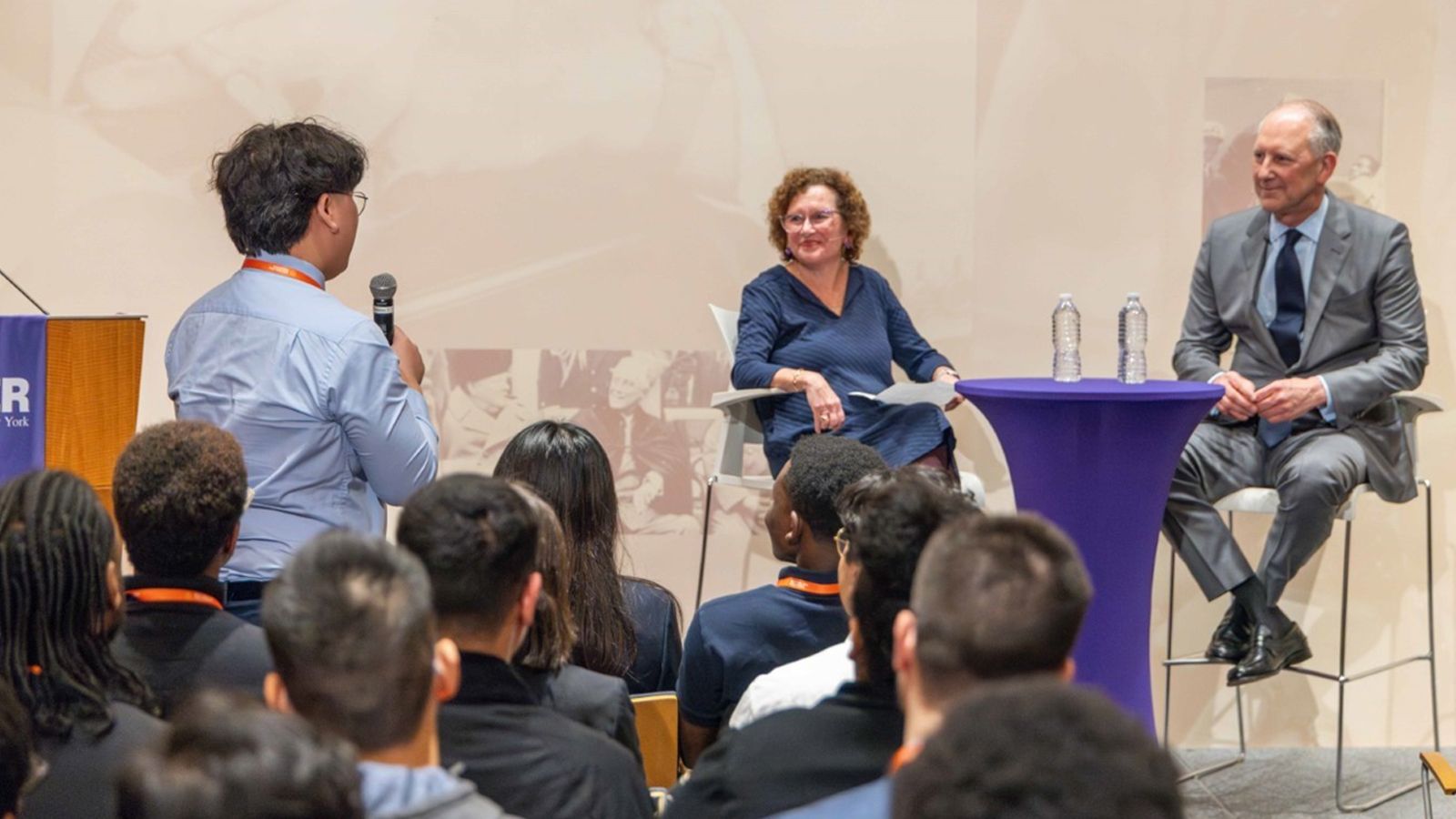 A student asking President Nancy Cantor and The AIG Chairman, Peter Zaffino a question
