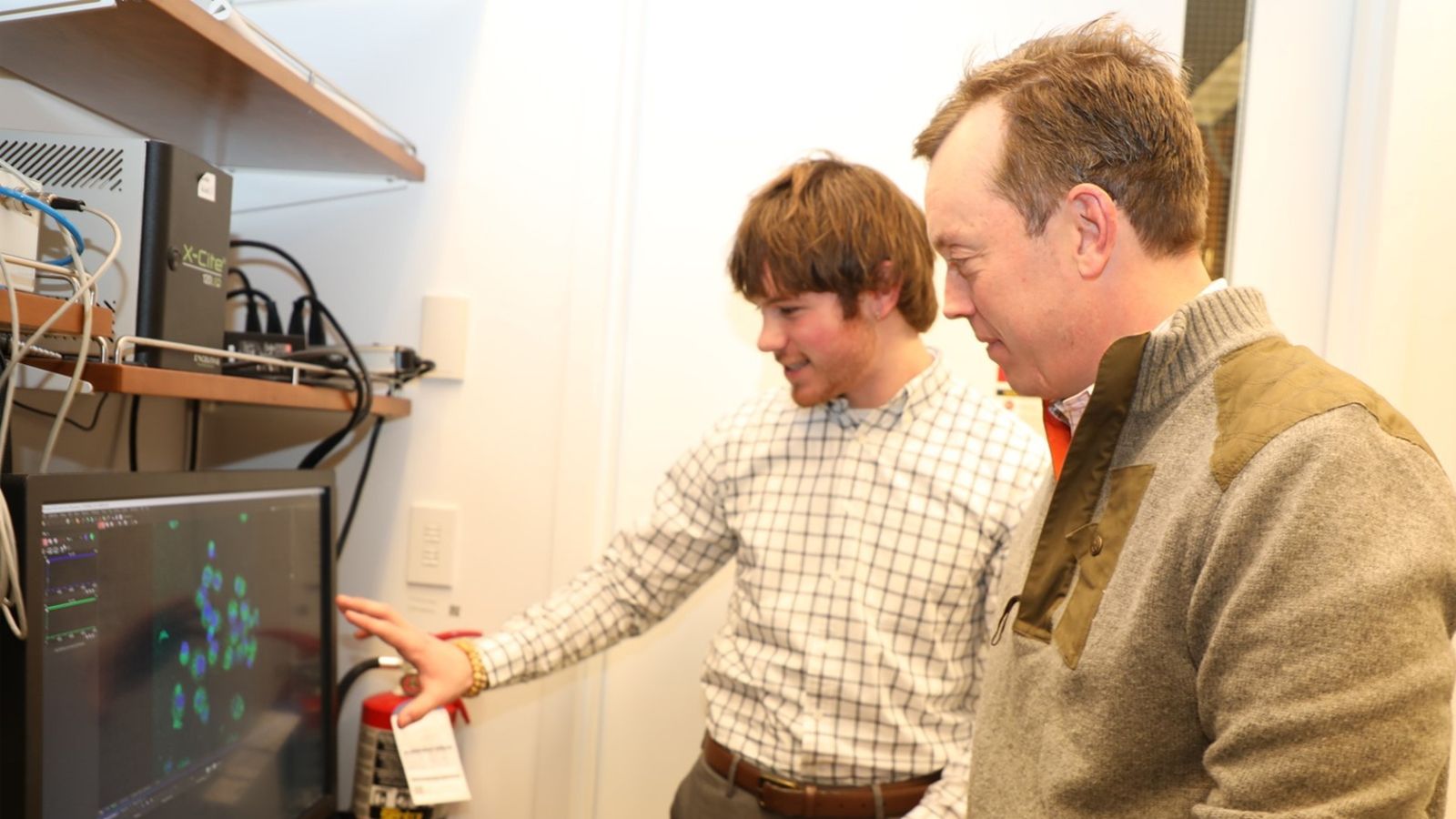 Professor Brian Zeglis, right, and Shane McGlone discuss their project.