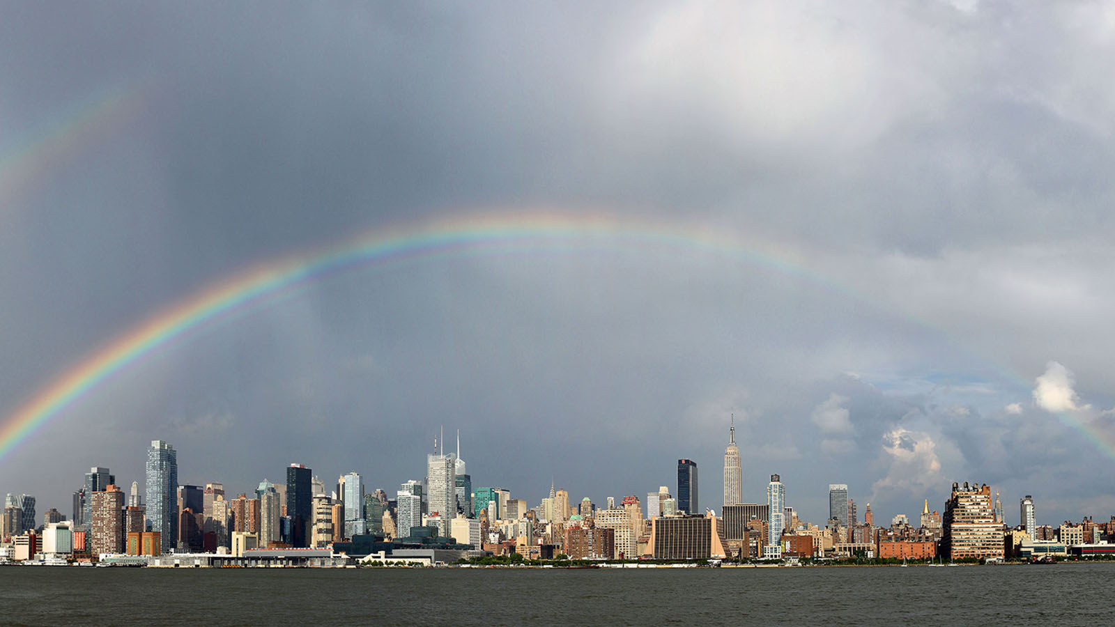 Rainbow over city landscape
