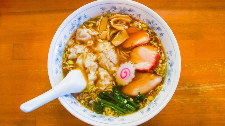 warm bowl of ramen on a wooden table