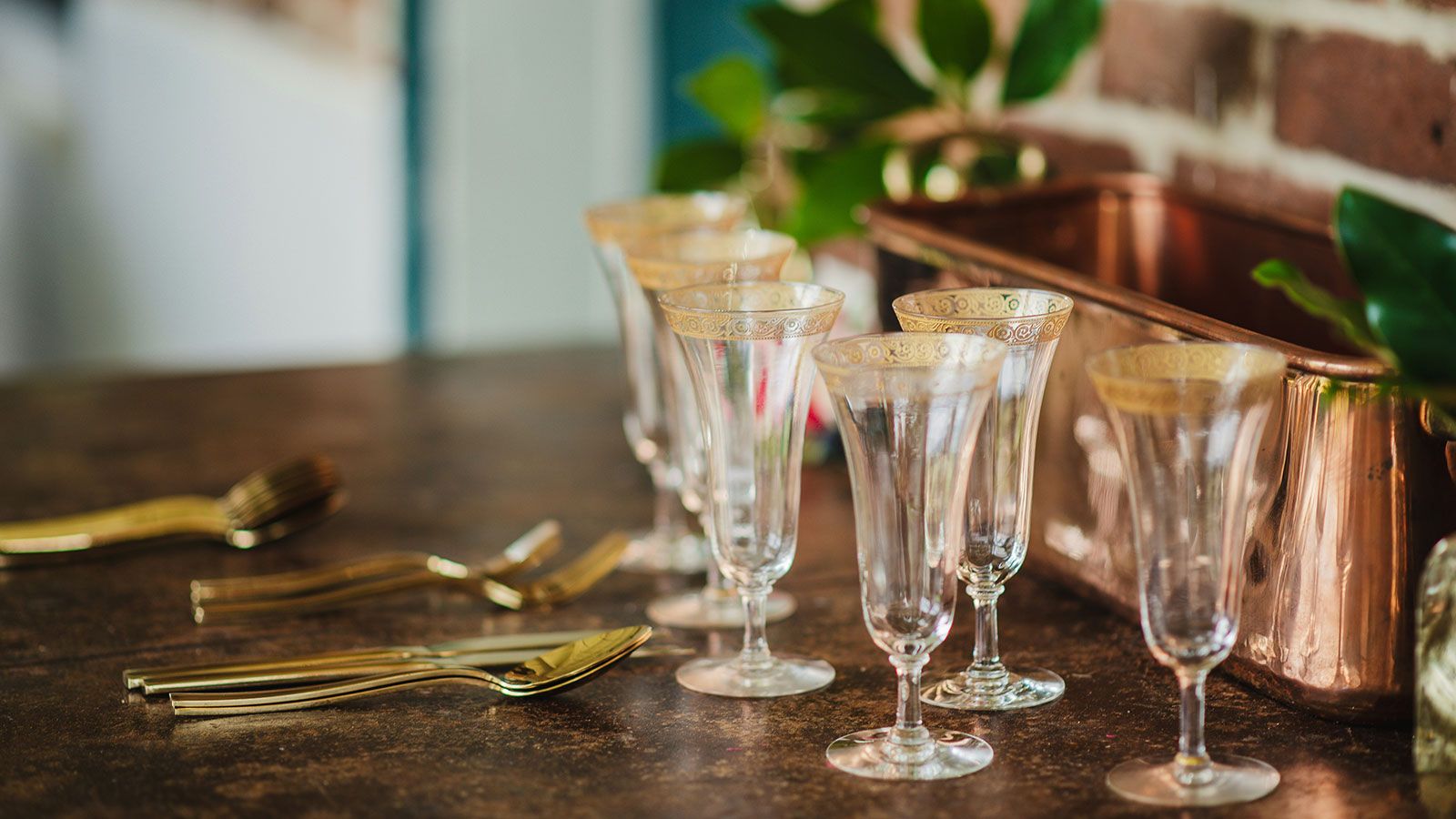 fine dining table setup with silverware and glasses