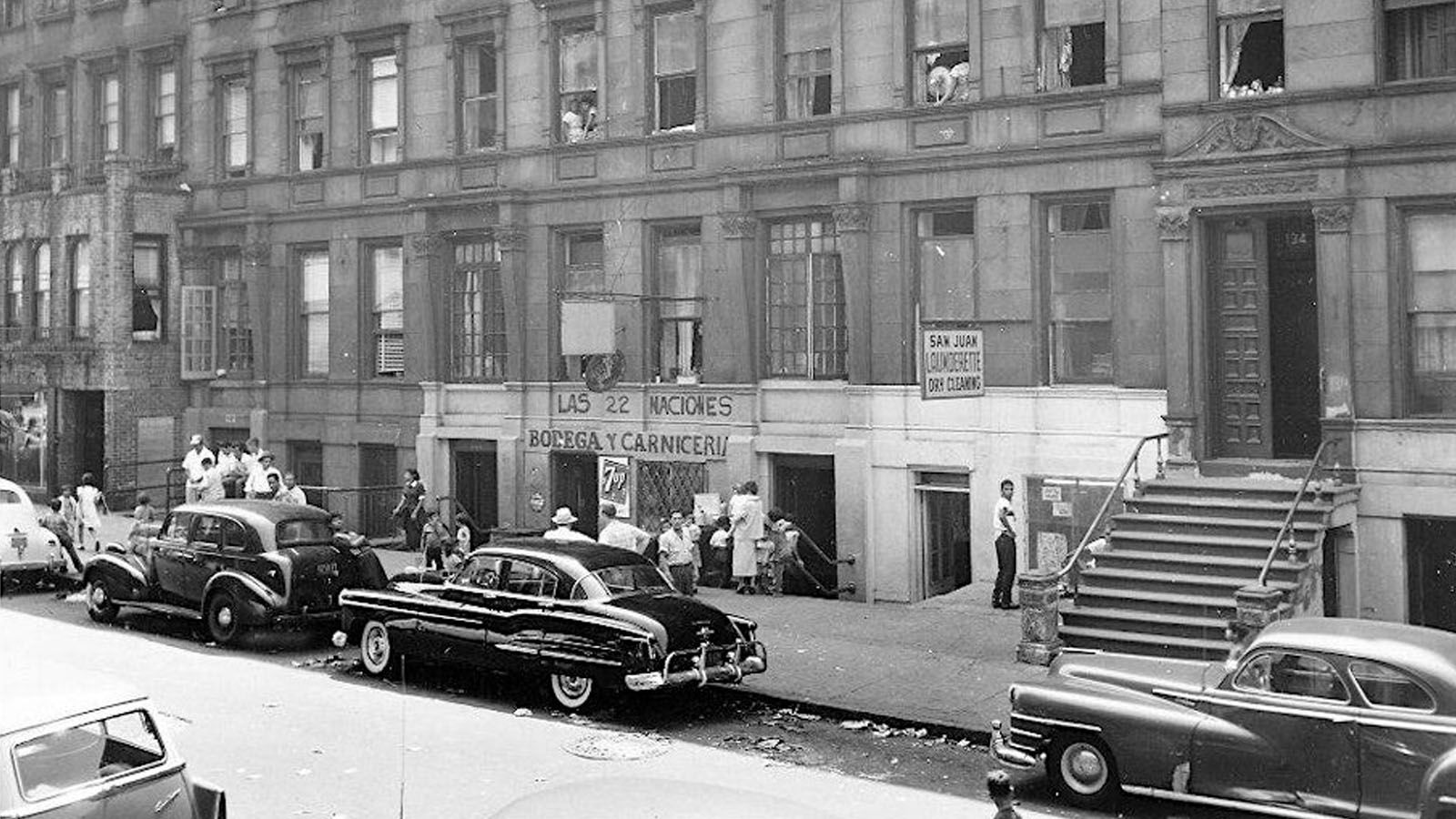 1956, Lincoln Square, street view of crowd near bodega, NYC Parks Photo Archive.