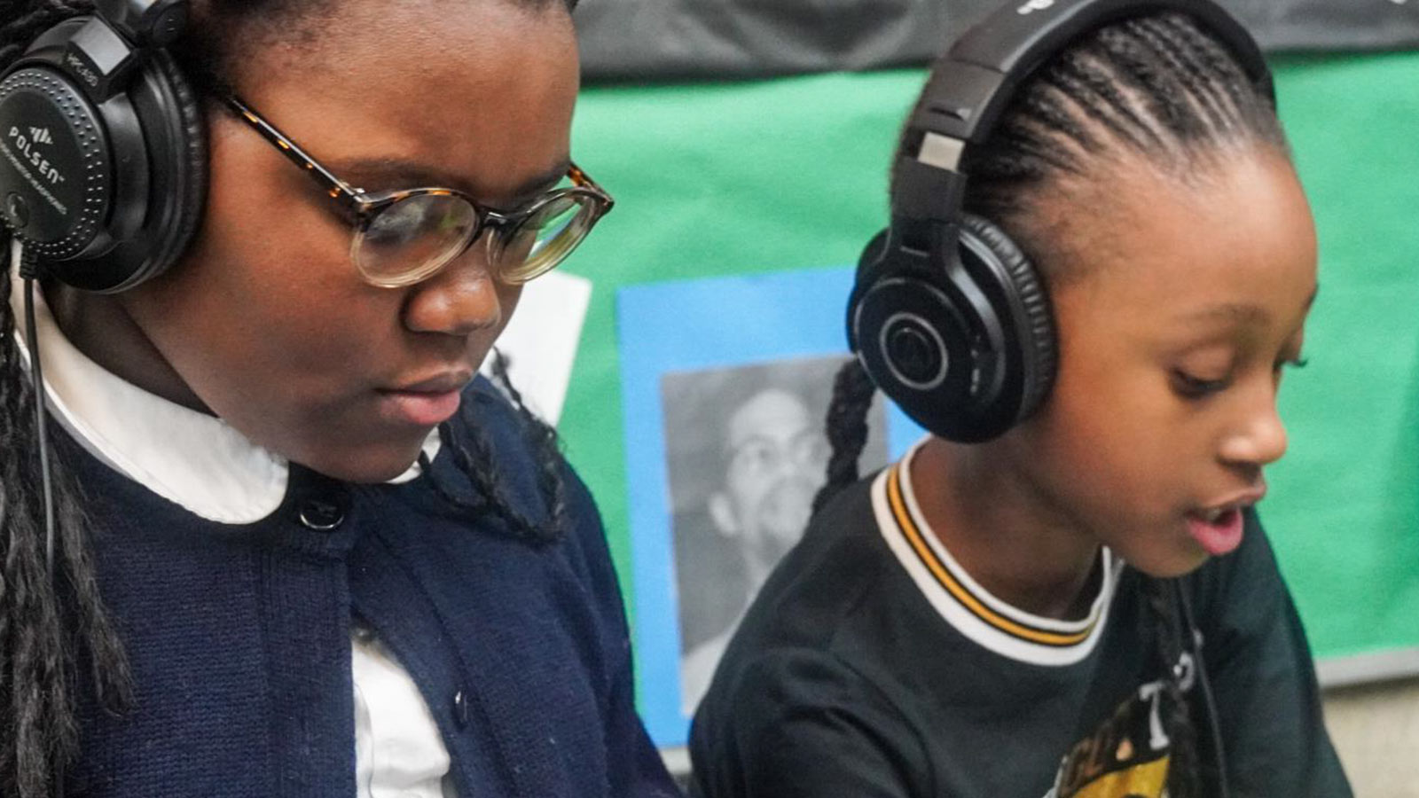 Students listening with headphones