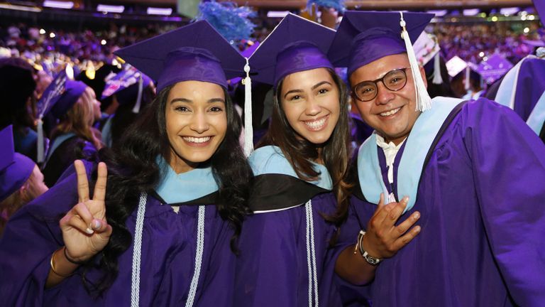 students celebrating at commencement in 2024