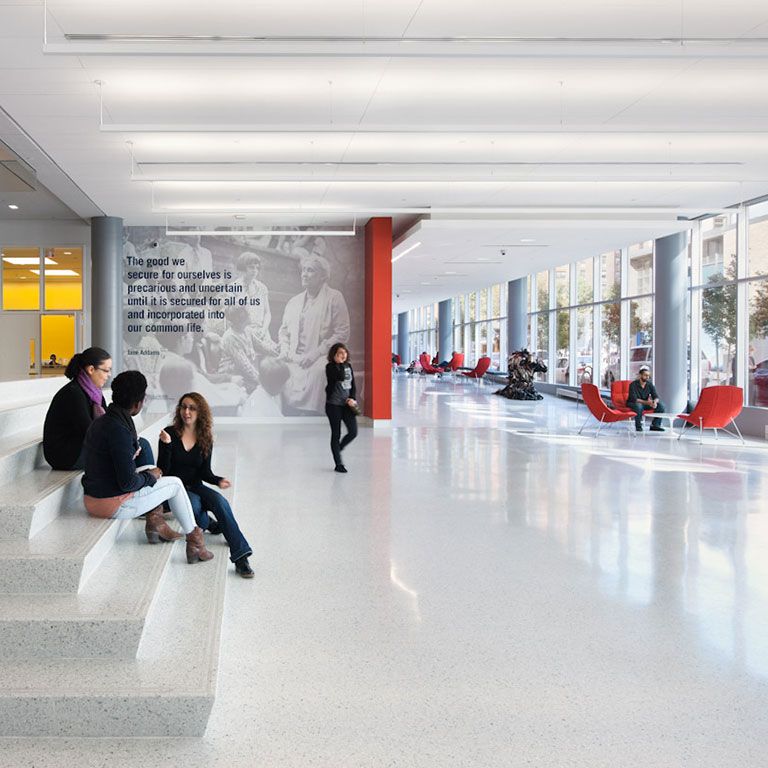Silberman Social Work building lobby with students on steps