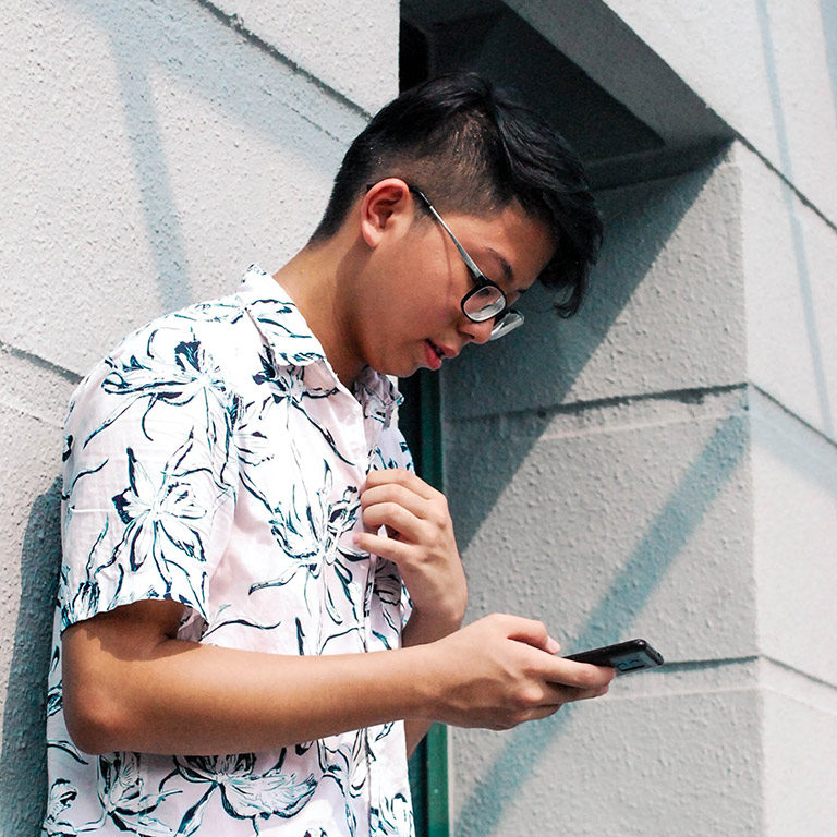 student looking at phone