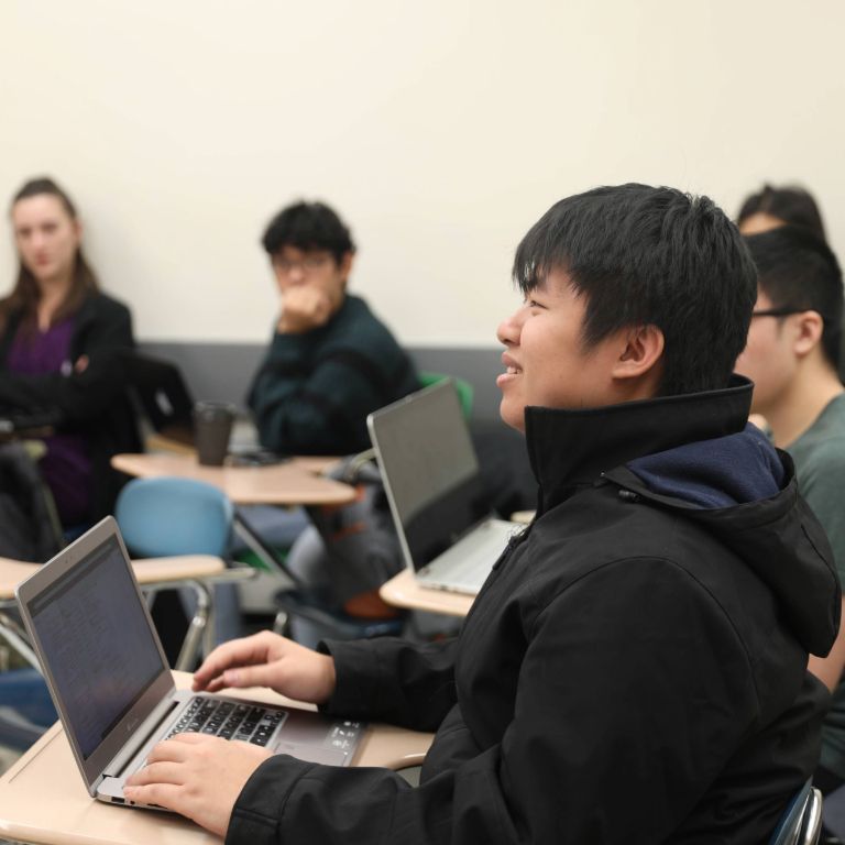 Student participating in classroom discussion