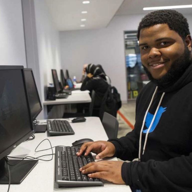 Student using computer in the library.