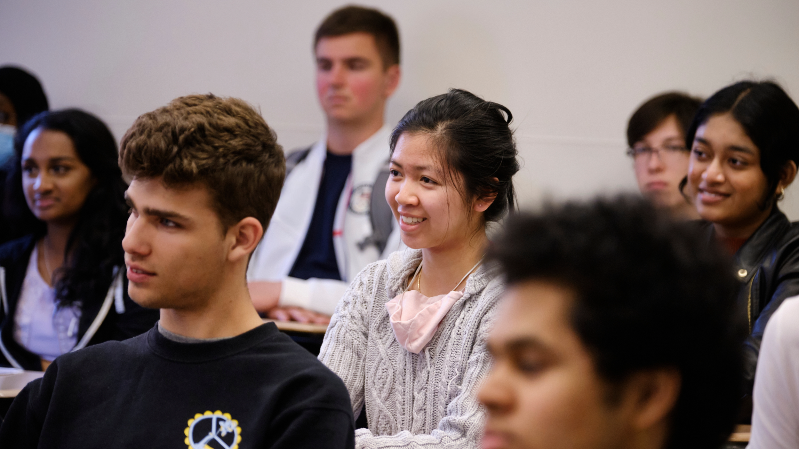 Hunter students in a classroom facing to their left