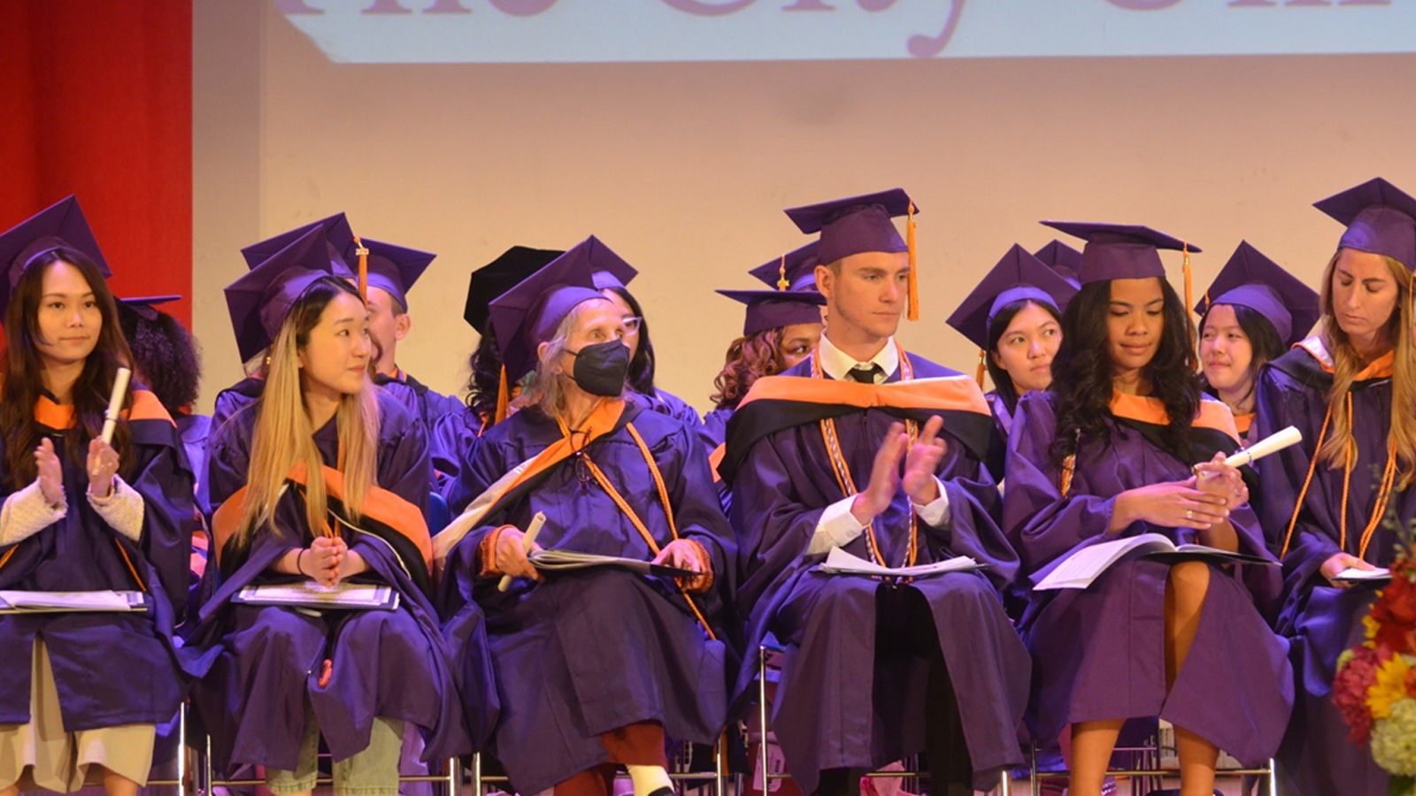 Students sitting on stage