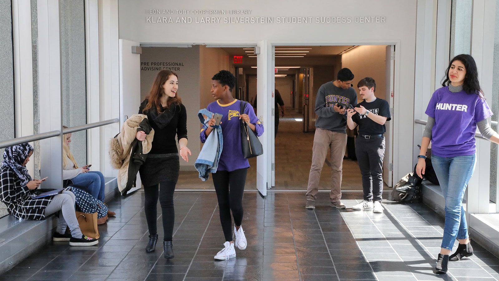 students walking in skybridge