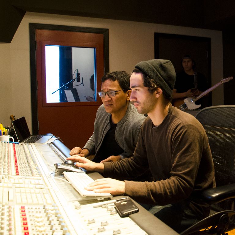 Students inside a recording studio.