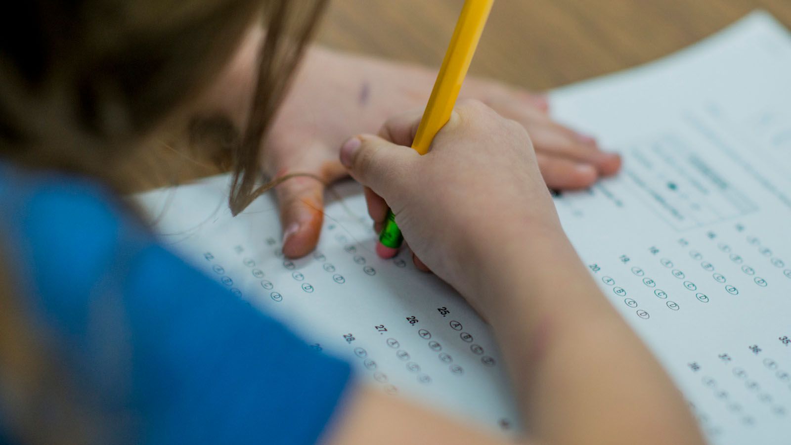 Middle school student taking a standardized high school entrance exam