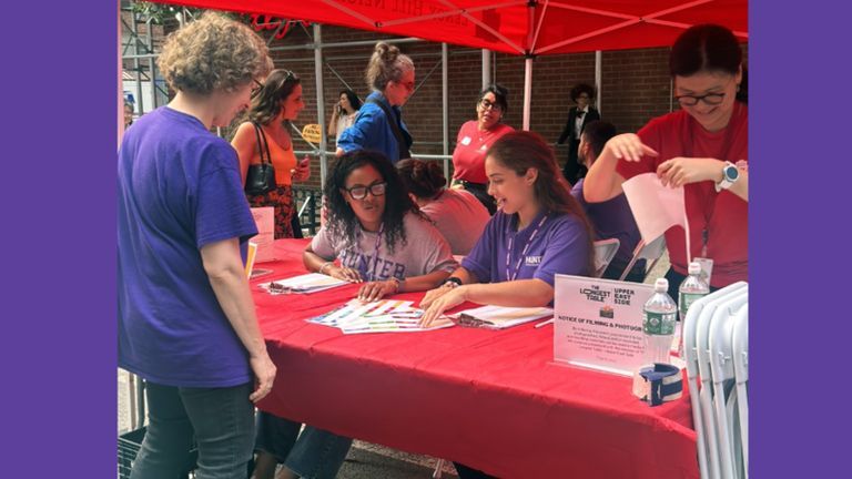 Hunter student ambassadors staff a table at ‘The Longest Table’ event.