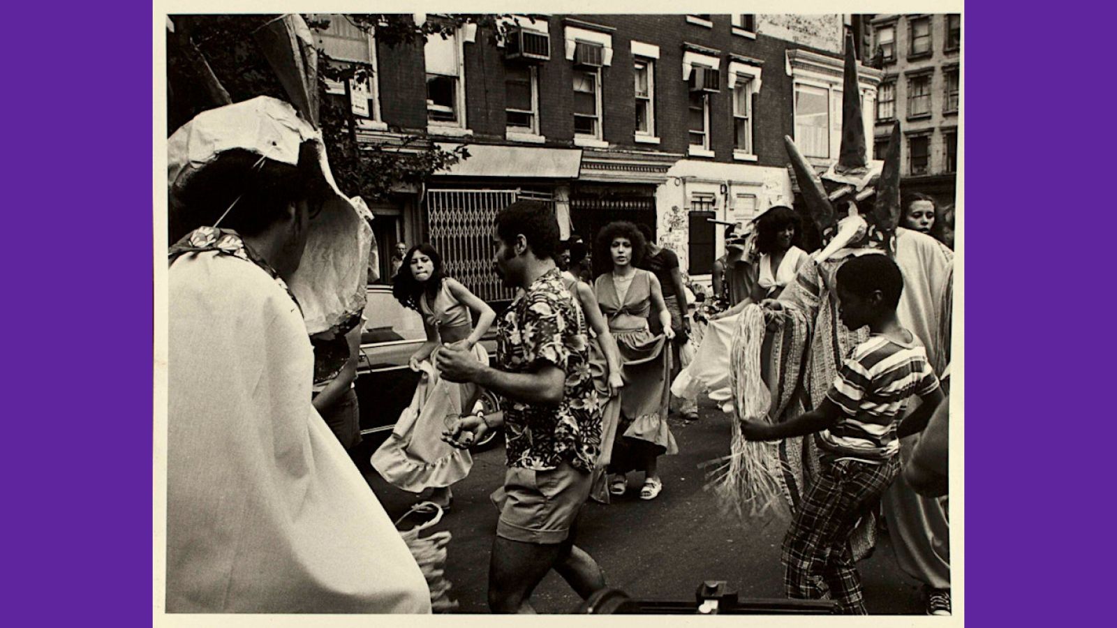 People dancing in the streets during the Feria de Expresión Puertorriqueña.