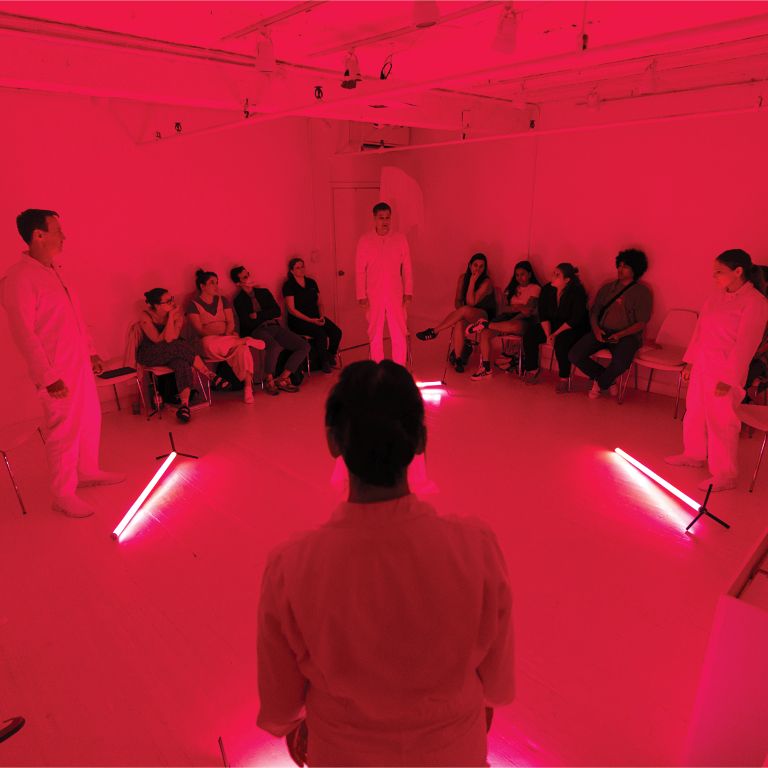 Actors on stage during performance of The Workers.