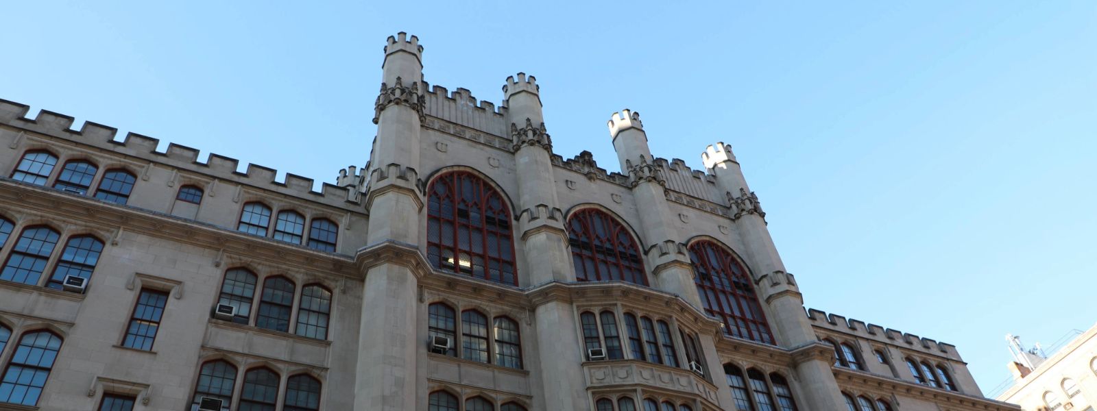 Photo of the front of Thomas Hunter Building, from the ground level looking up