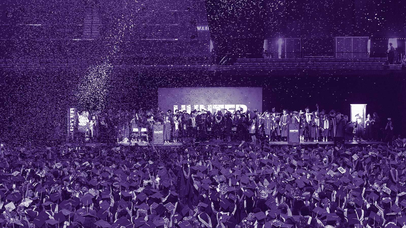 students celebrating on stage at Barcalys Center in Spring 2023