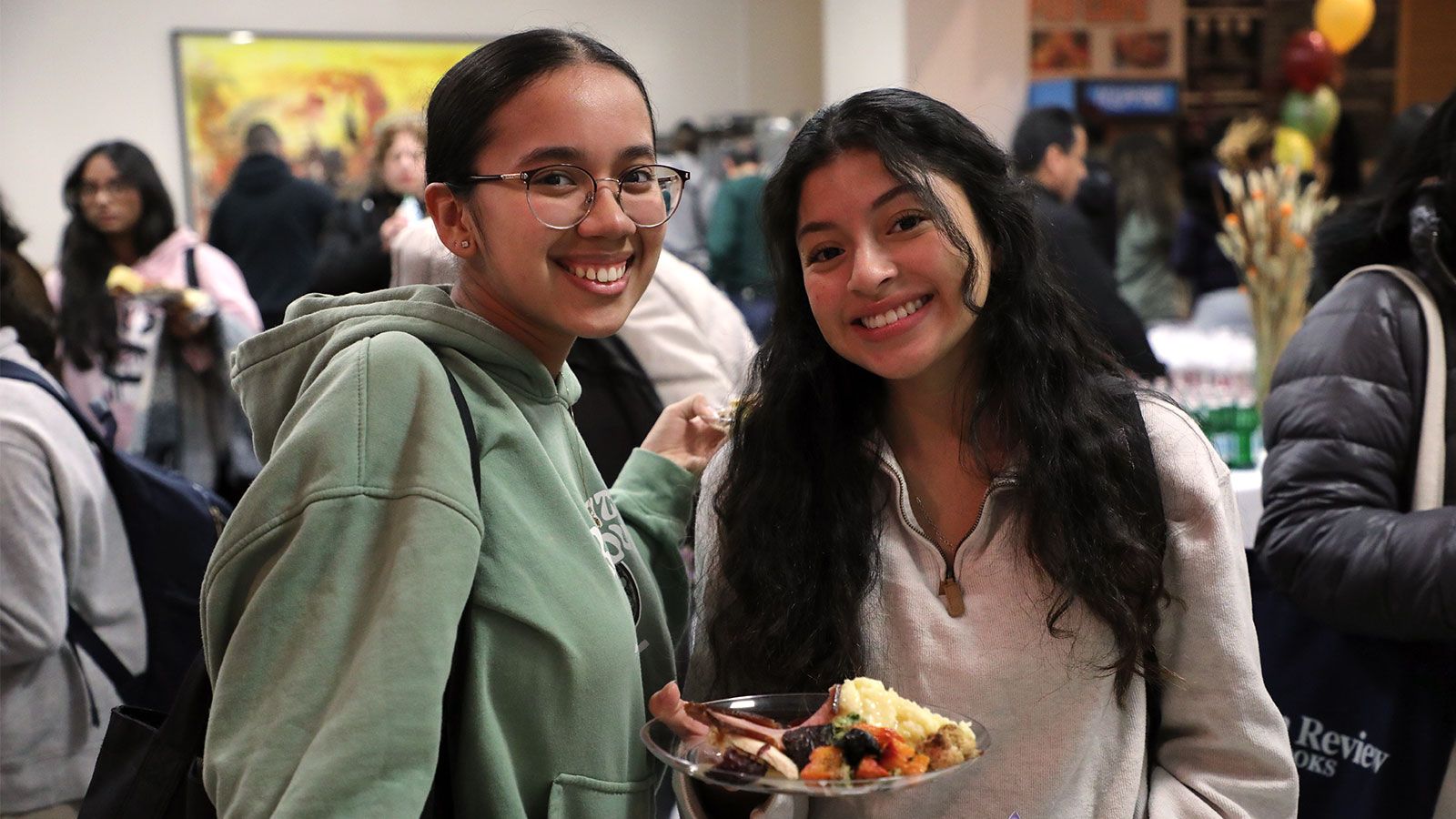 two hunter students at thanksgiving dinner